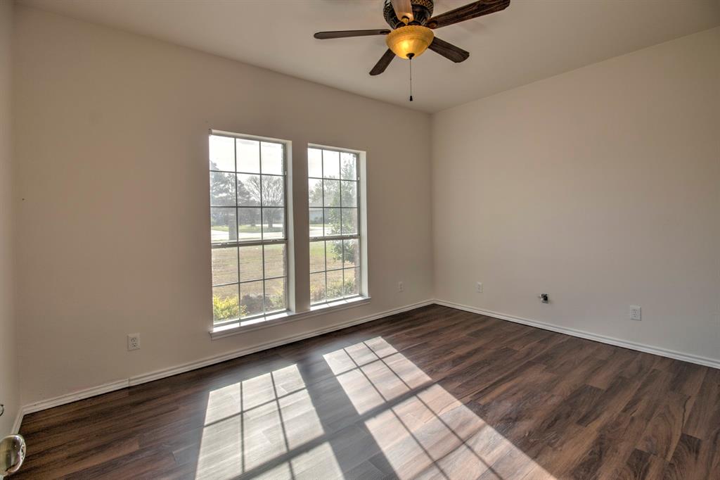 1400 North St Charles Street Pilot Point, TX 76258 - Photo 23 of 30 a view of an empty room with a window