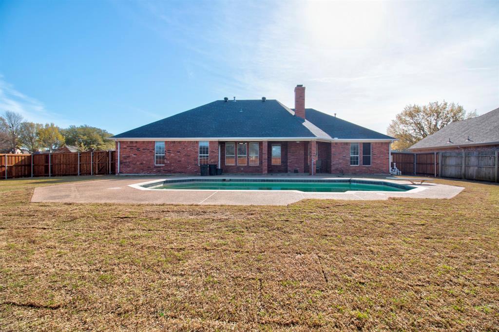 1400 North St Charles Street Pilot Point, TX 76258 - Photo 27 of 30 a view of a house with a yard