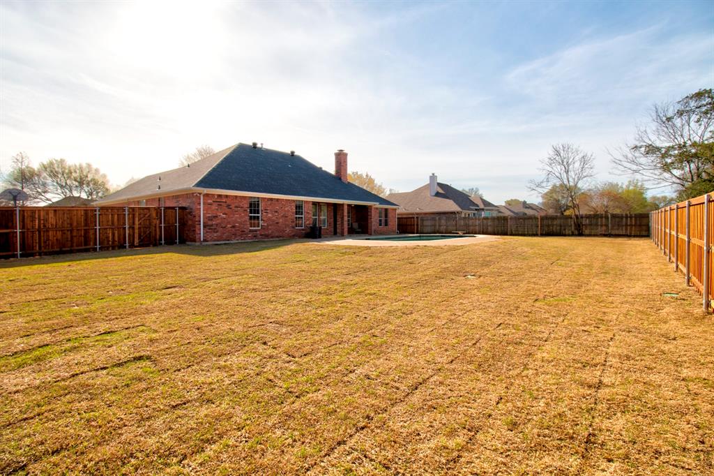 1400 North St Charles Street Pilot Point, TX 76258 - Photo 28 of 30 a view of a house with a yard and a large window