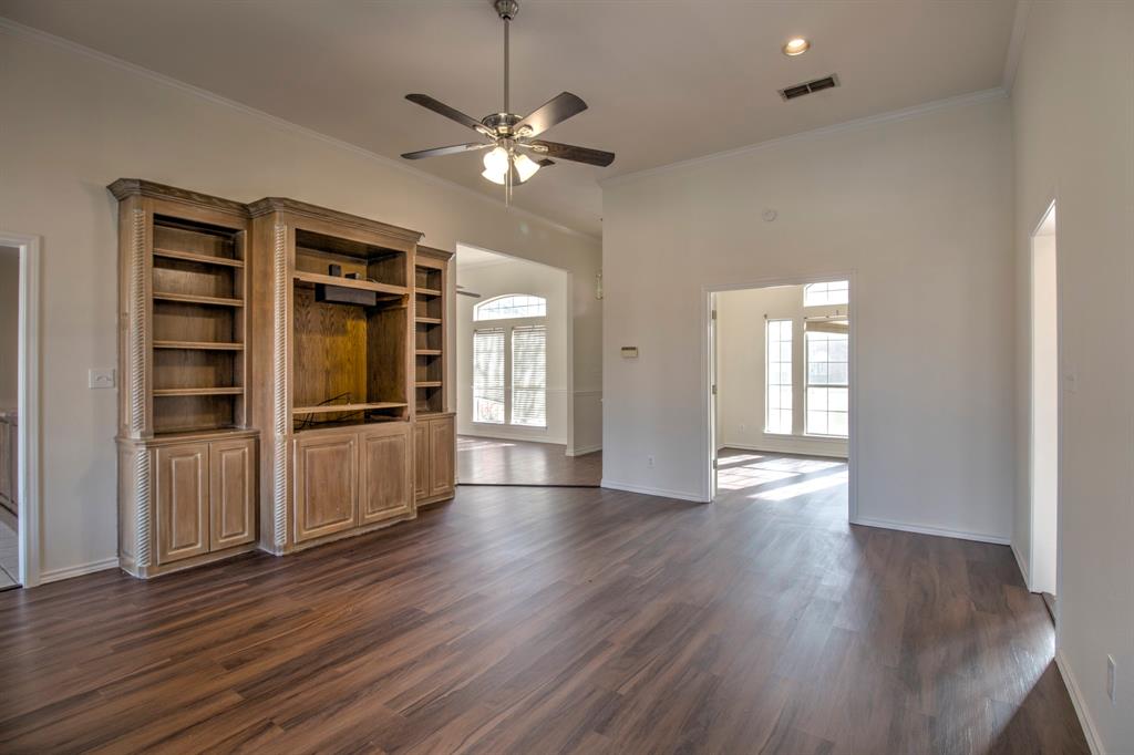 1400 North St Charles Street Pilot Point, TX 76258 - Photo 8 of 30 a view of wooden floor and windows in a room