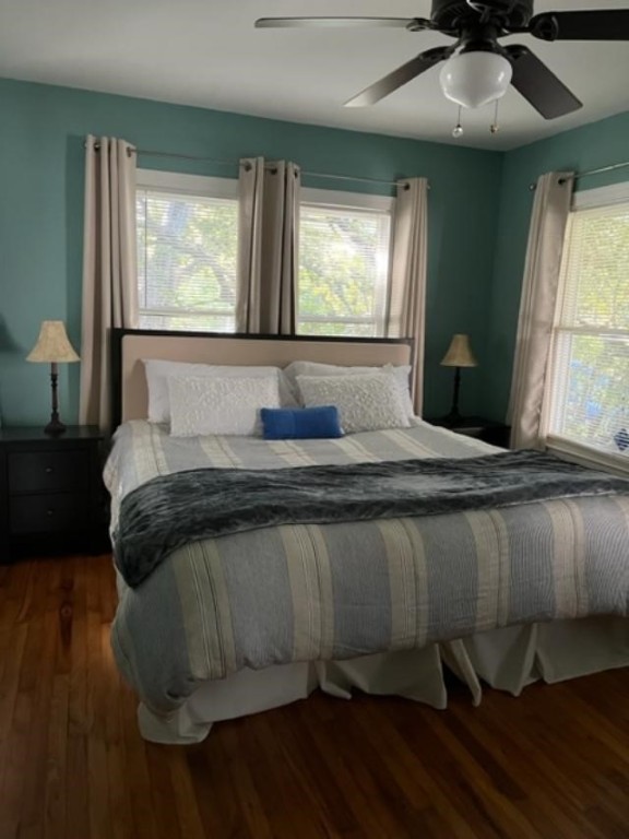 Undisclosed Address Austin, TX 78704 - Photo 2 of 10 a bedroom with a bed and wooden floor