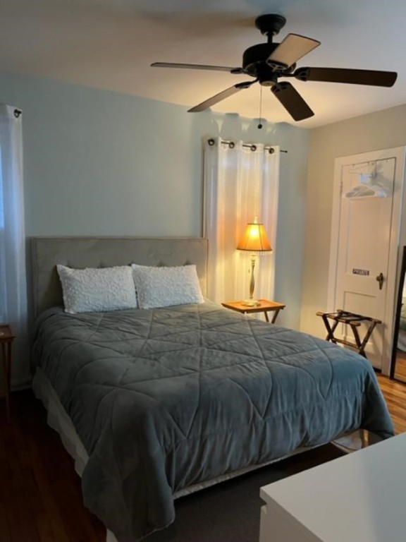 Undisclosed Address Austin, TX 78704 - Photo 4 of 10 a bedroom with a bed and a chandelier