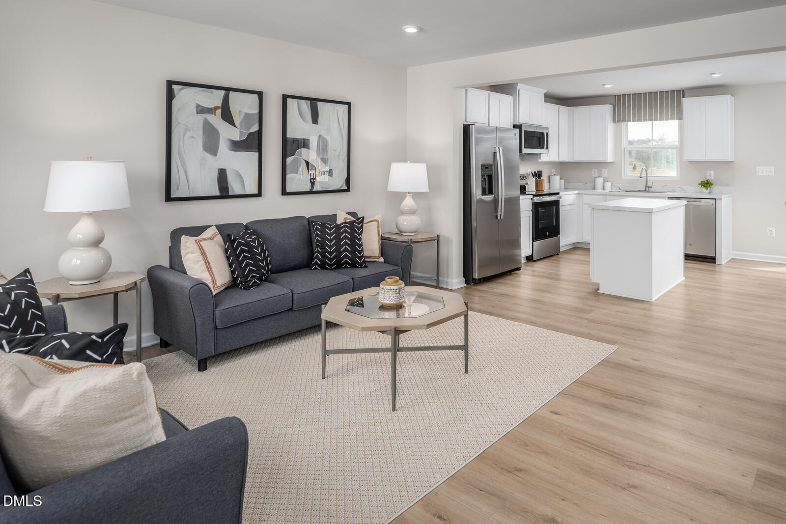 1253 Rollman Farm Road Raleigh, NC 27603 - Photo 11 of 24 a living room with stainless steel appliances furniture and a kitchen view