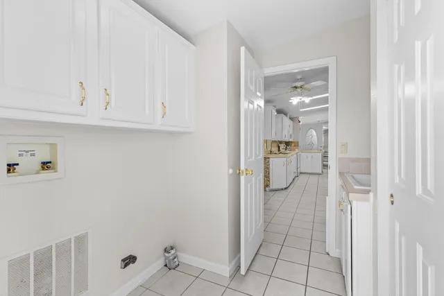 an aerial view of a house with a swimming pool