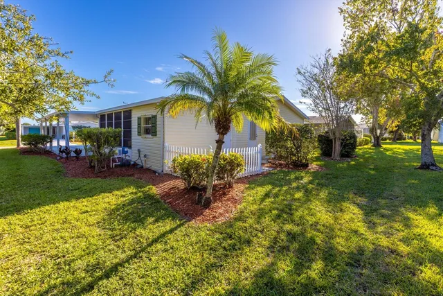 an aerial view of a house a yard and patio