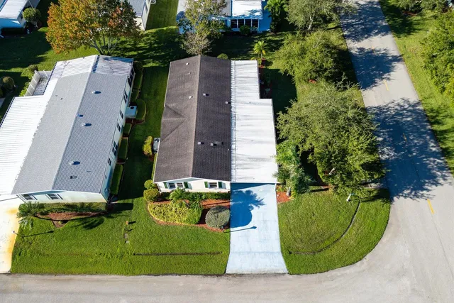 a view of a backyard with swimming pool