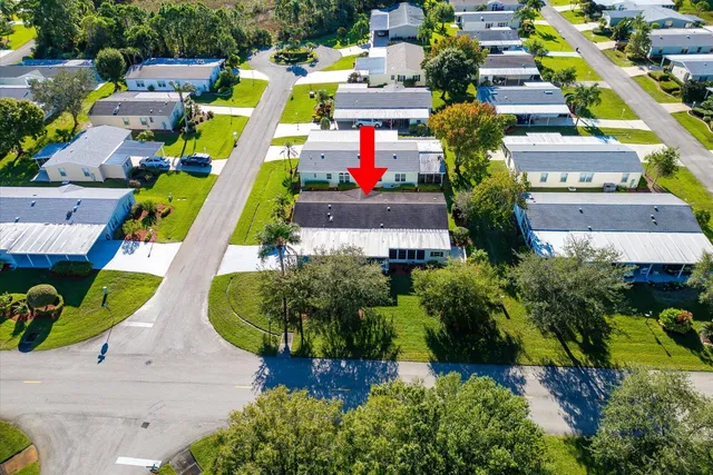 an aerial view of residential houses with outdoor space