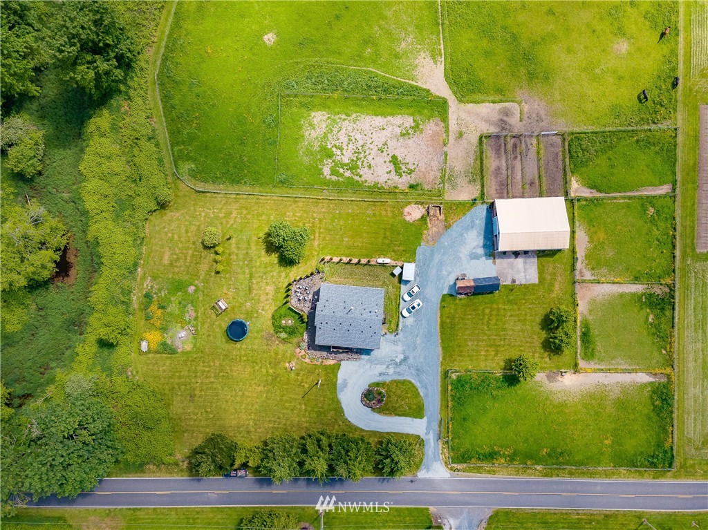 4165 Deming Road Everson, WA 98247 - Photo 2 of 31 an aerial view of residential houses with outdoor space and swimming pool