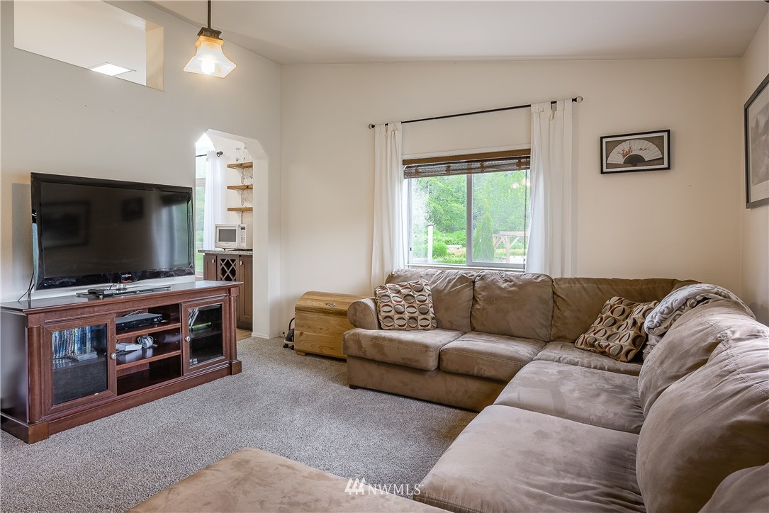 4165 Deming Road Everson, WA 98247 - Photo 15 of 31 a living room with furniture and a flat screen tv