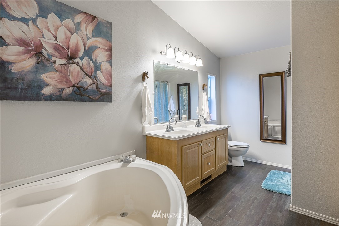 4165 Deming Road Everson, WA 98247 - Photo 18 of 31 a bathroom with a sink mirror and vanity