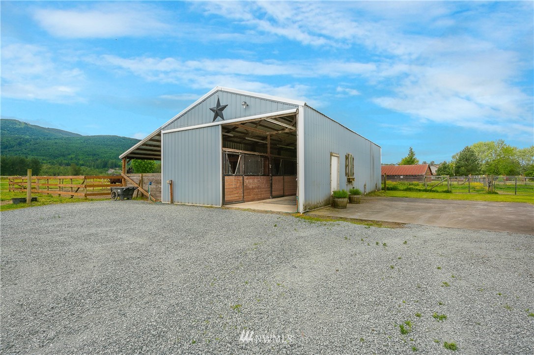 4165 Deming Road Everson, WA 98247 - Photo 3 of 31 a view of a house with a yard and garage