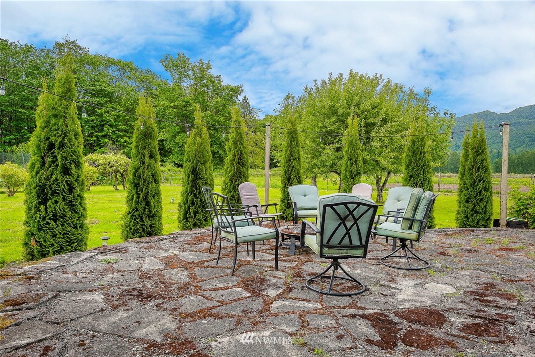 4165 Deming Road Everson, WA 98247 - Photo 22 of 31 a view of a chairs and table in backyard