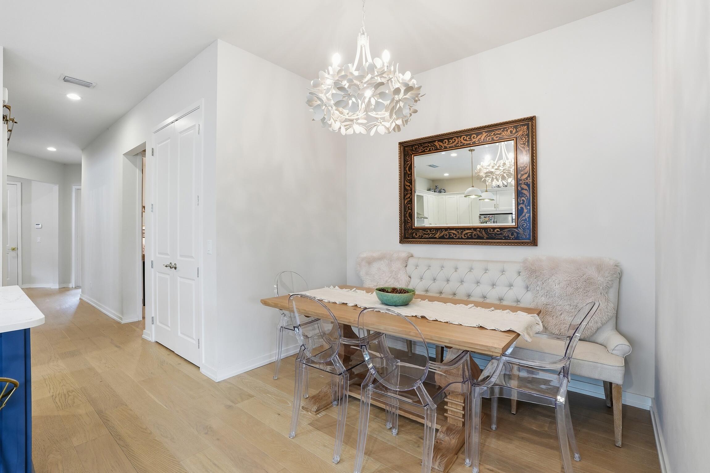 14708 Kingfisher Loop Naples, FL 34120 - Photo 14 of 42 a dining room with a table and chairs
