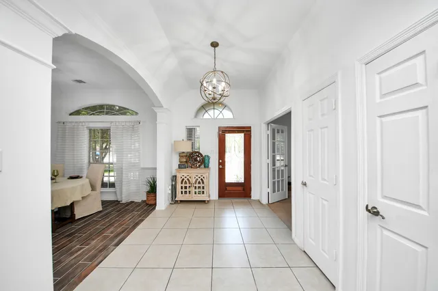 a very nice looking dining room with a table and chairs
