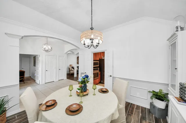a view of a hallway view with wooden floor and staircase