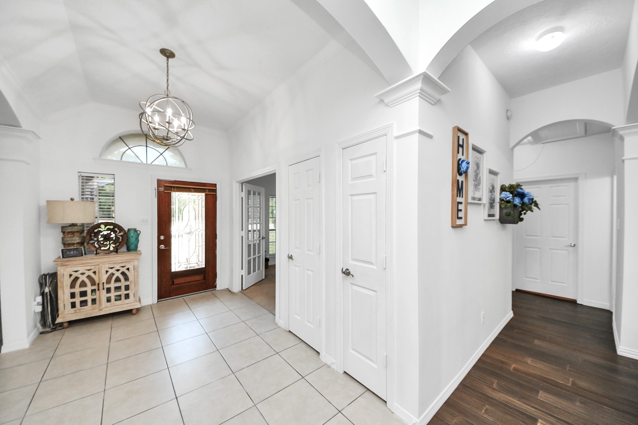 5231 South Fm 565 Rd Cove Cove, TX 77523 - Photo 17 of 50 a view of a hallway view with wooden floor and staircase