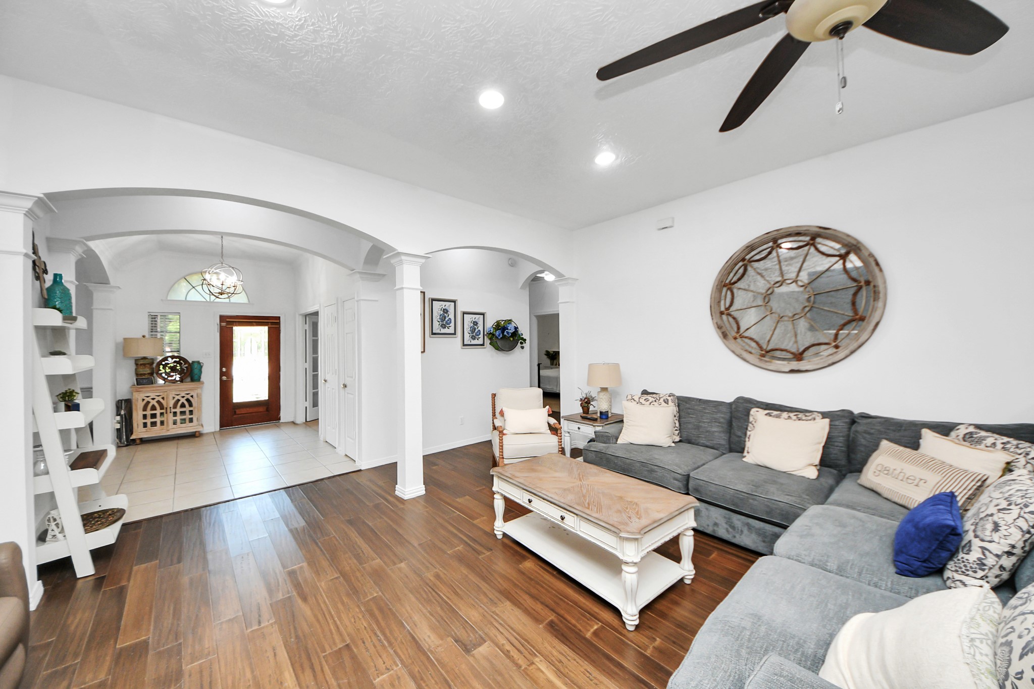5231 South Fm 565 Rd Cove Cove, TX 77523 - Photo 18 of 50 a living room with furniture and a wooden floor
