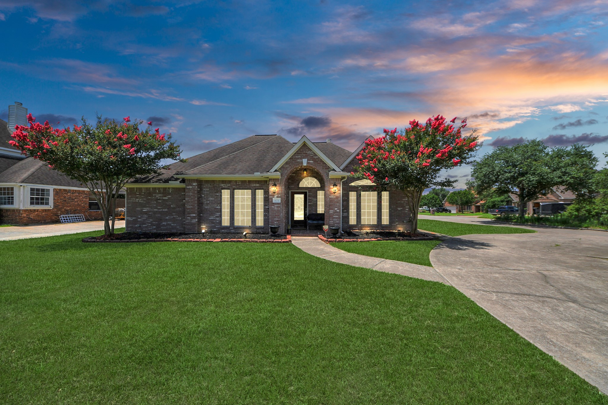 5231 South Fm 565 Rd Cove Cove, TX 77523 - Photo 2 of 50 a front view of a house with a garden