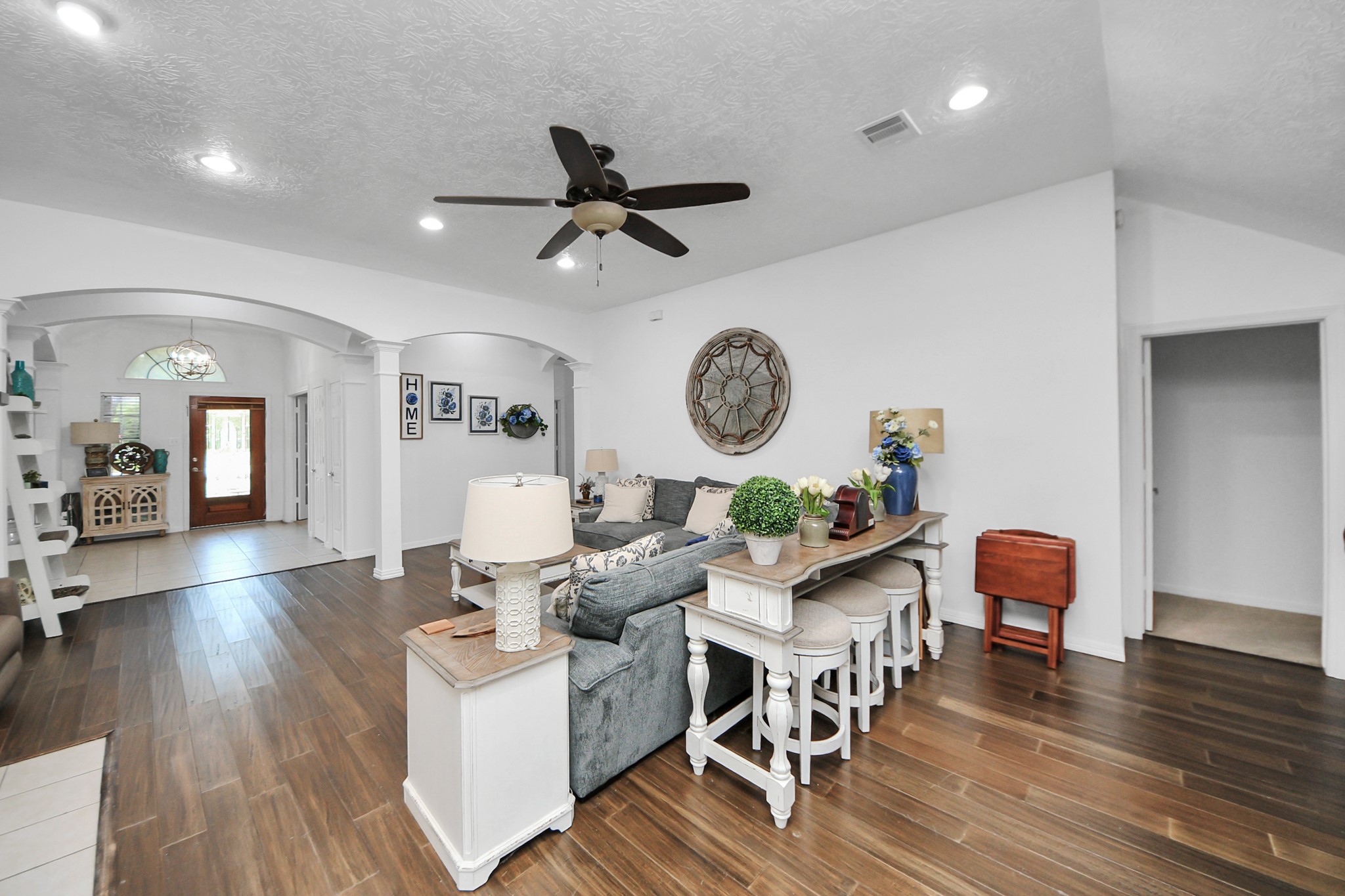 5231 South Fm 565 Rd Cove Cove, TX 77523 - Photo 23 of 50 a living room with furniture and a wooden floor