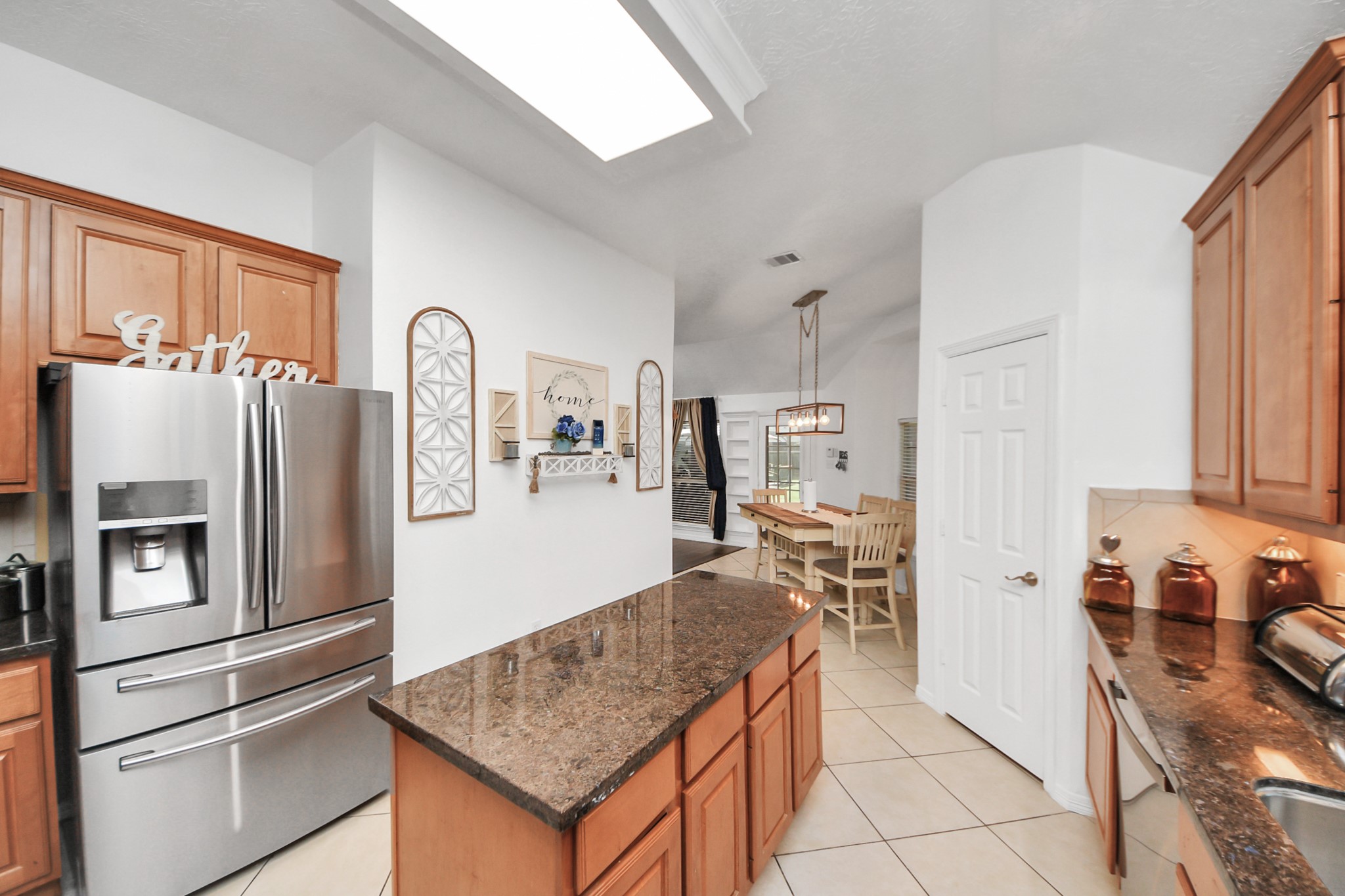 5231 South Fm 565 Rd Cove Cove, TX 77523 - Photo 26 of 50 a kitchen with stainless steel appliances granite countertop a refrigerator and a stove top oven