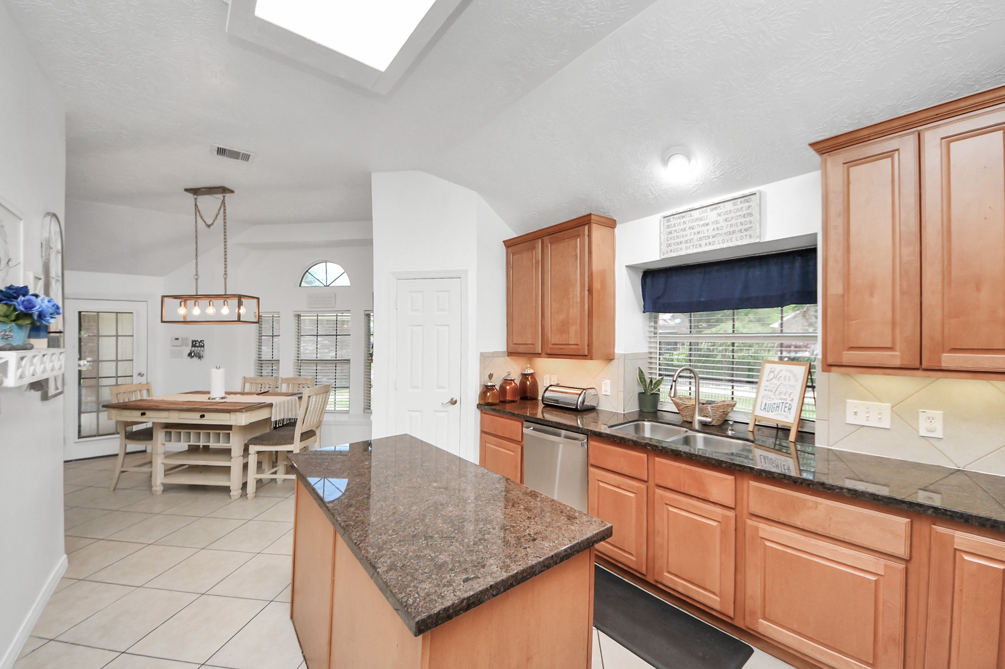 5231 South Fm 565 Rd Cove Cove, TX 77523 - Photo 27 of 50 a kitchen with stainless steel appliances granite countertop sink stove top oven and cabinets