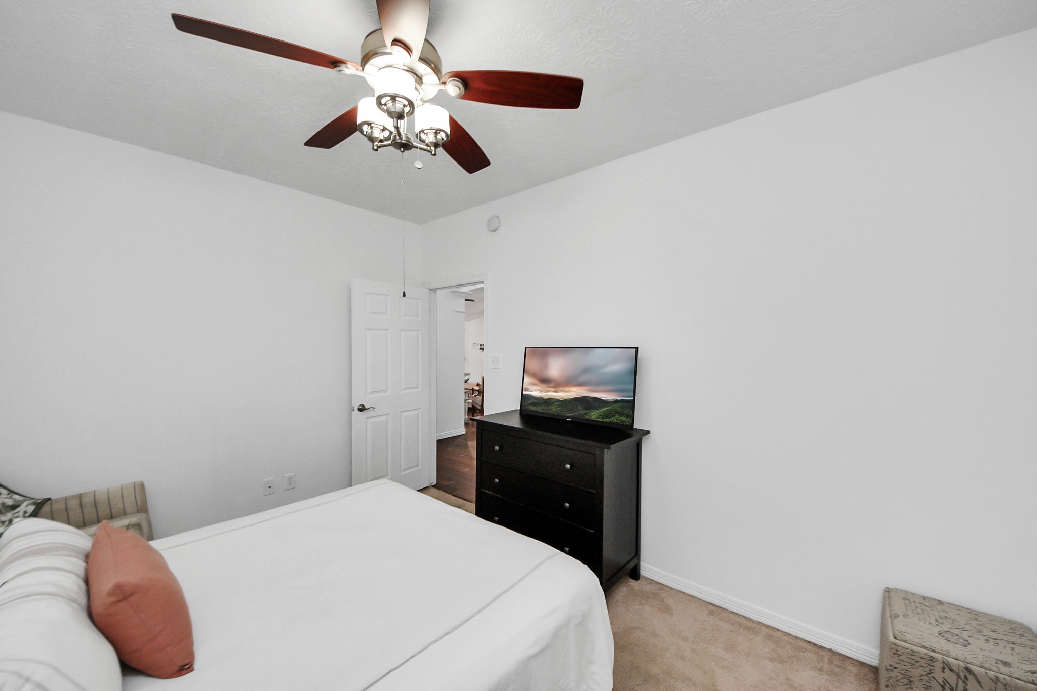 5231 South Fm 565 Rd Cove Cove, TX 77523 - Photo 36 of 50 a bedroom with a bed and a chandelier