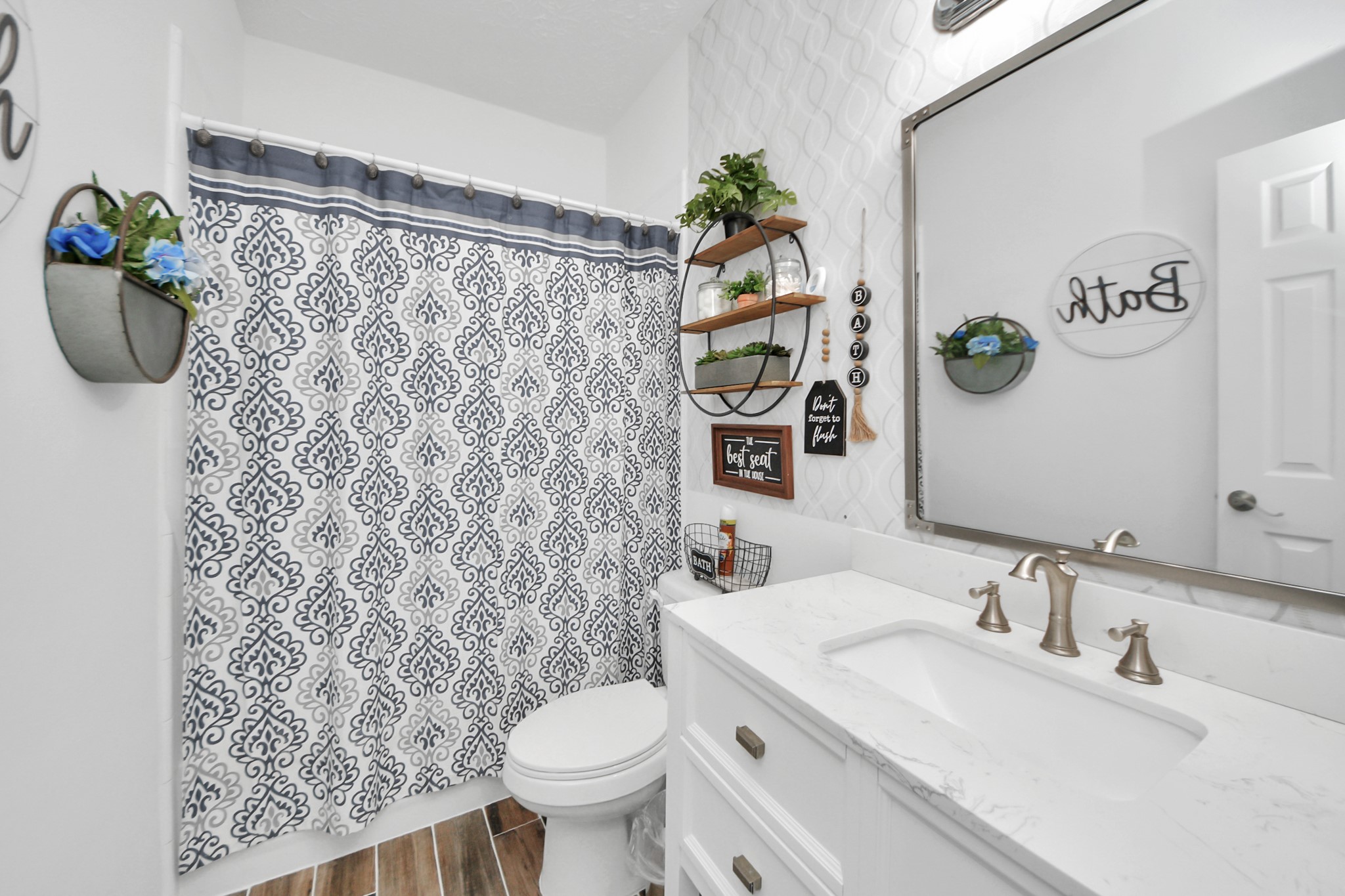 5231 South Fm 565 Rd Cove Cove, TX 77523 - Photo 38 of 50 a bathroom with a sink and a mirror