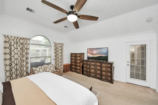 a bathroom with a tub a sink and a mirror