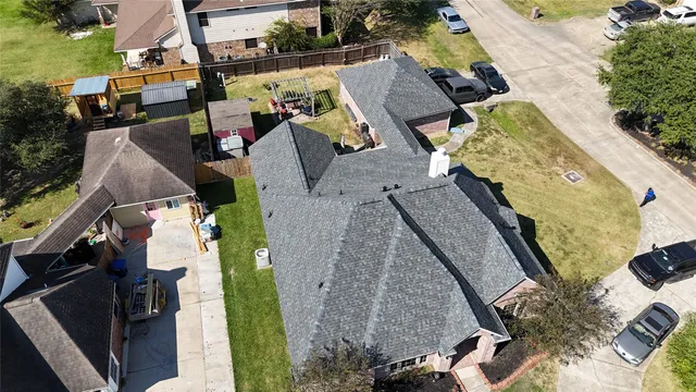 an aerial view of houses with outdoor space