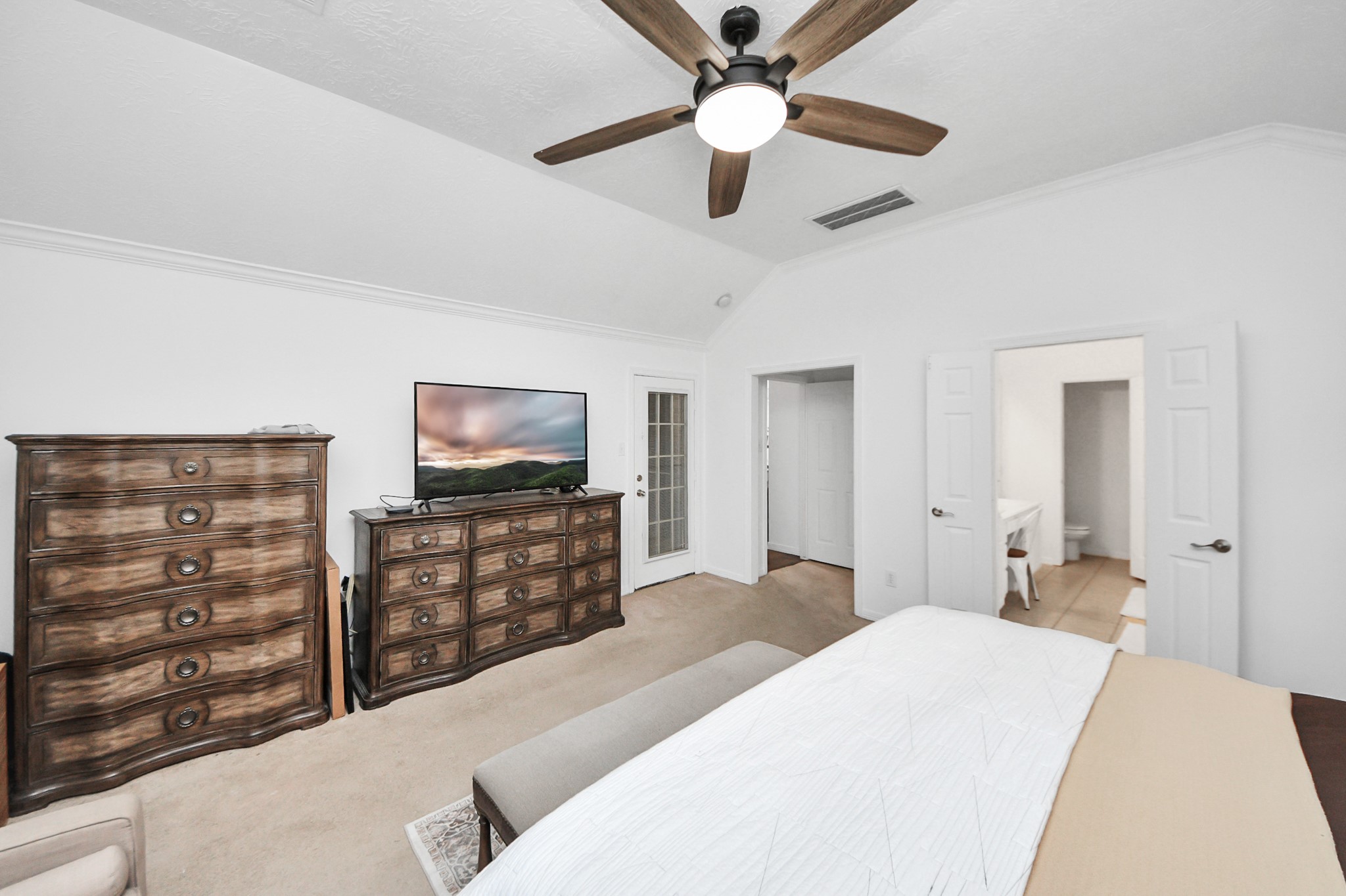 5231 South Fm 565 Rd Cove Cove, TX 77523 - Photo 41 of 50 a bedroom with a bed and a flat screen tv