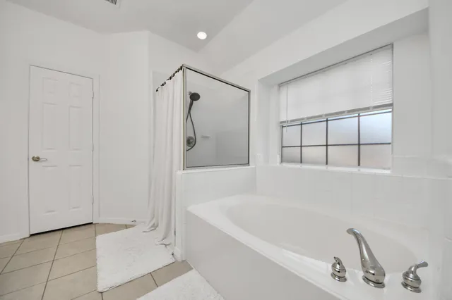 a patio with patio a table and chairs under an umbrella