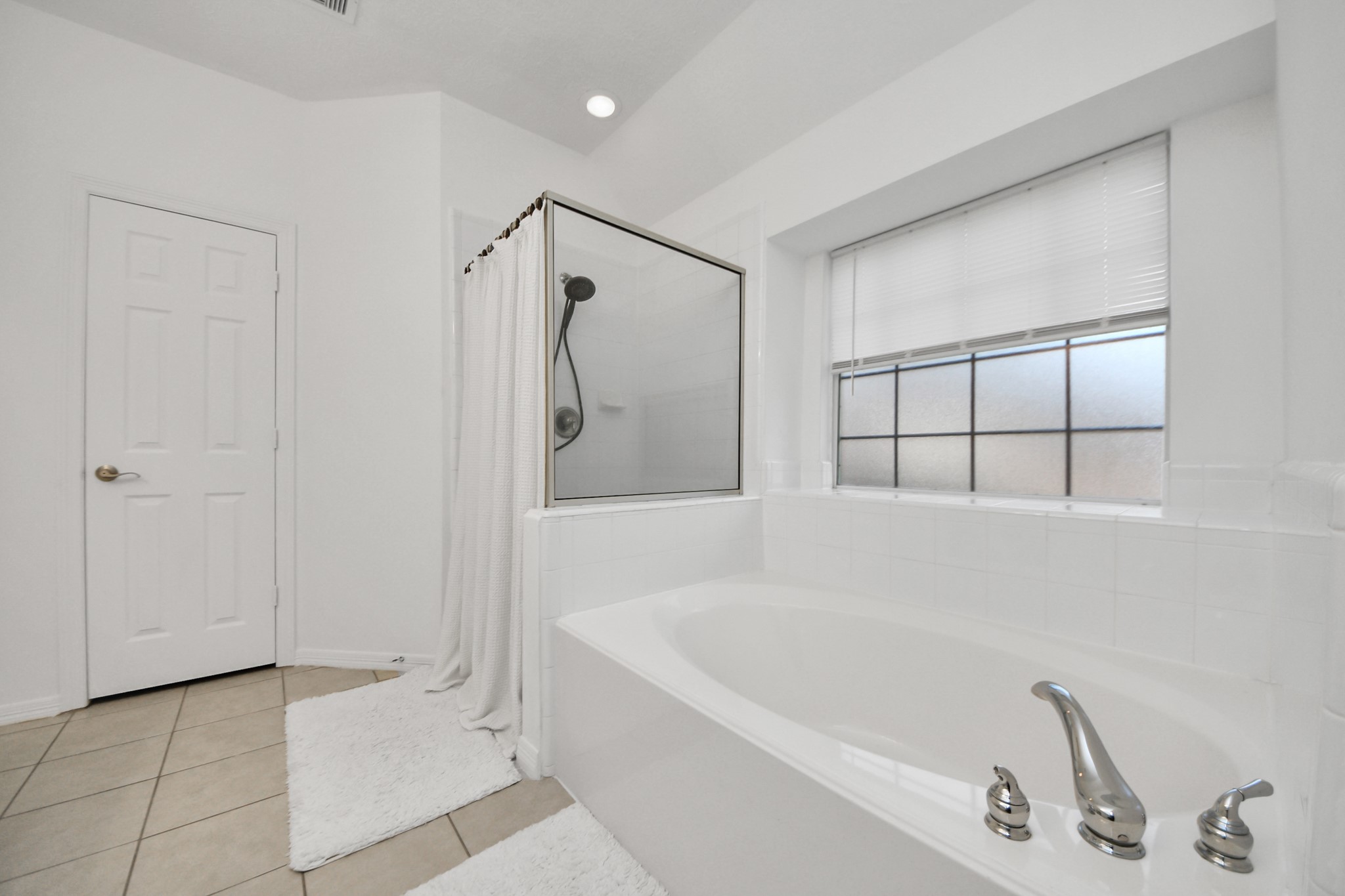 5231 South Fm 565 Rd Cove Cove, TX 77523 - Photo 44 of 50 a bathroom with a tub and a shower