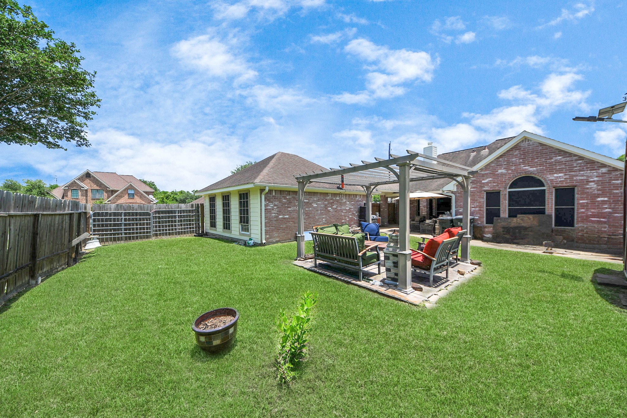 5231 South Fm 565 Rd Cove Cove, TX 77523 - Photo 48 of 50 a view of a house with backyard porch and garden