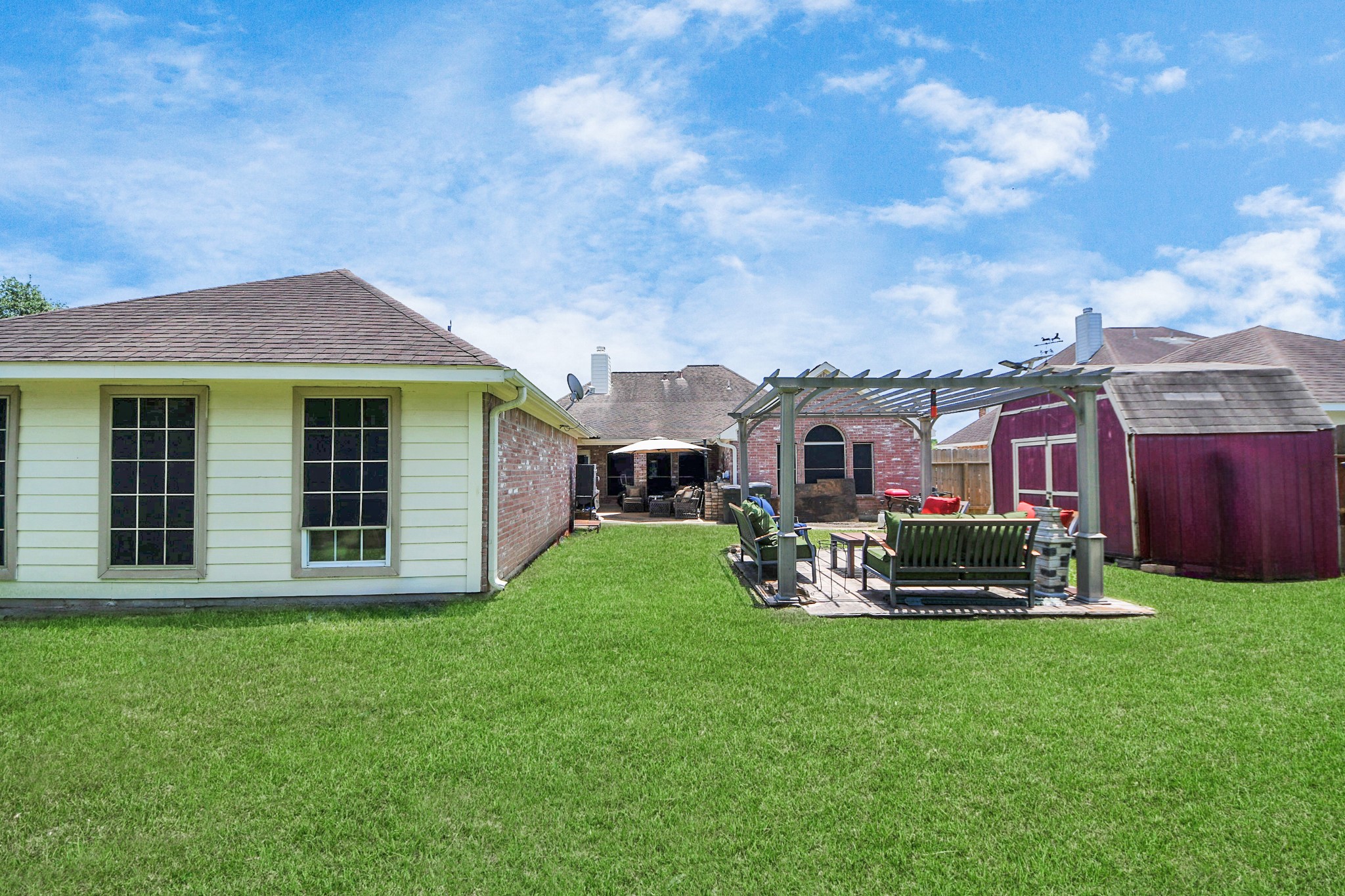 5231 South Fm 565 Rd Cove Cove, TX 77523 - Photo 49 of 50 a front view of a house with a garden