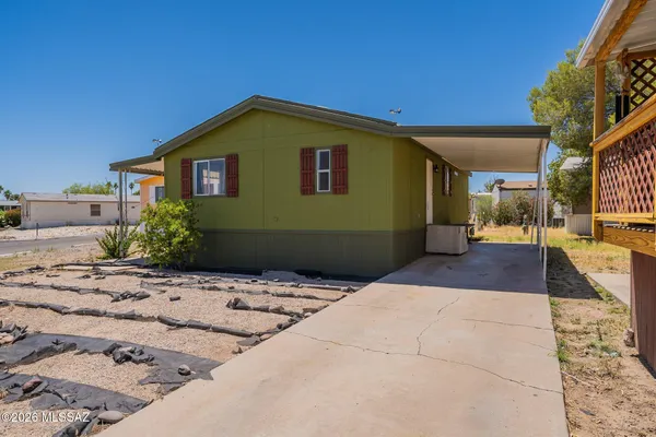 a view of backyard of a house