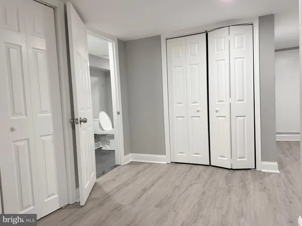 an empty room with wooden floor