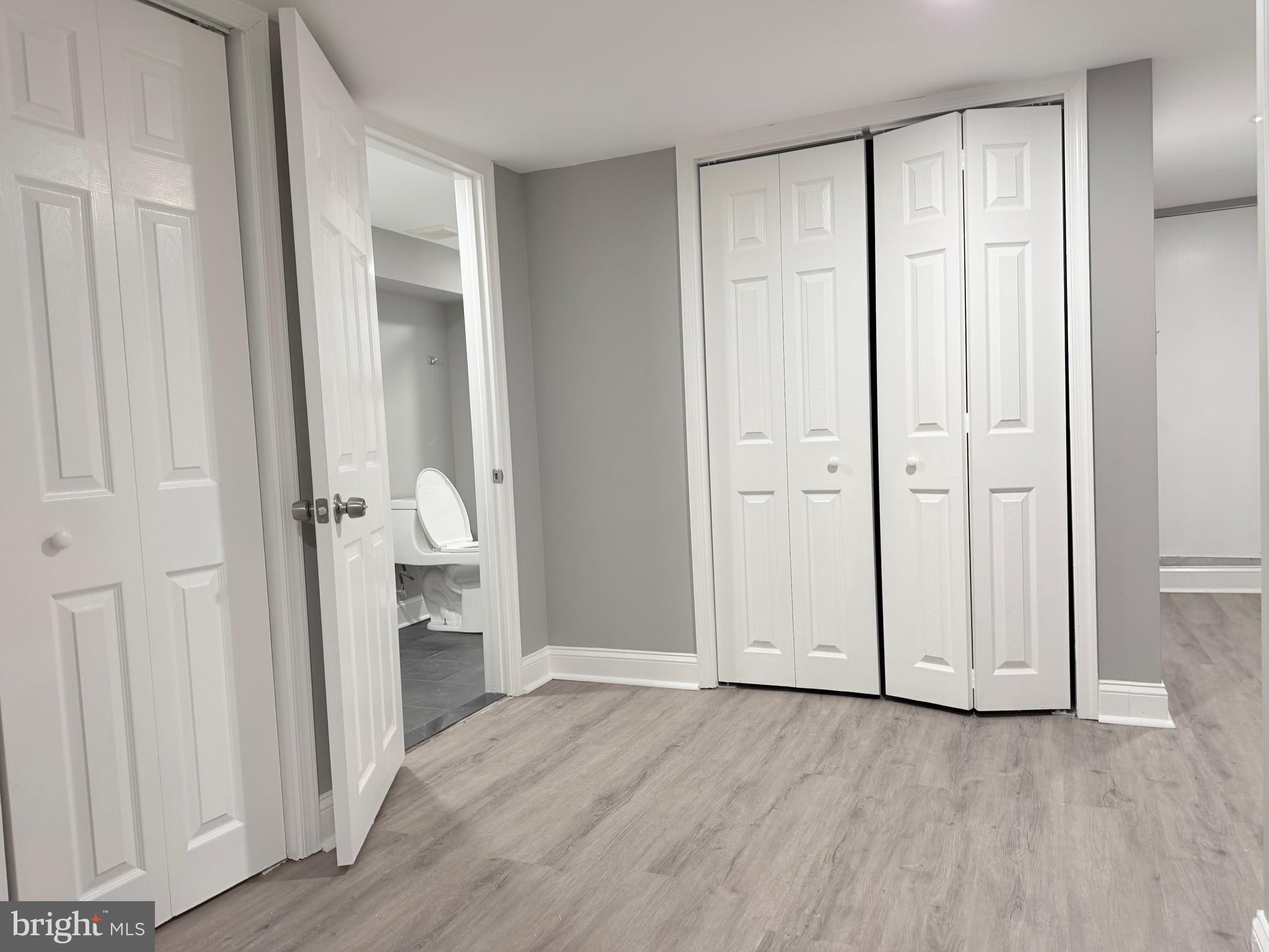 5115 Pembridge Avenue Baltimore, MD 21215 - Photo 15 of 29 an empty room with wooden floor