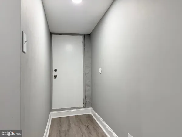 a view of bathroom with hardwood floor