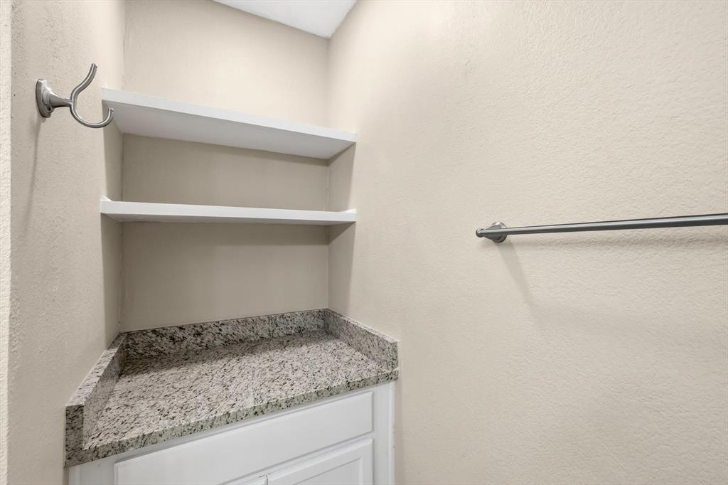 7733 Liz Lane Watauga, TX 76148 - Photo 18 of 27 Bathroom featuring a textured wall