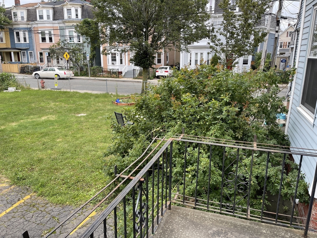 79 Newton Street, Unit 79 Somerville, MA 02143 - Photo 14 of 24 a view of building with yard