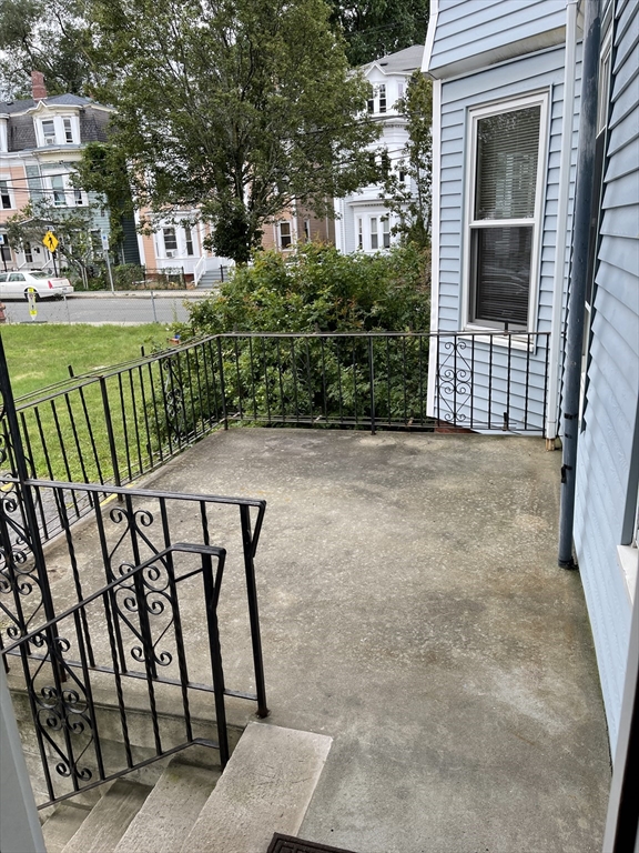 79 Newton Street, Unit 79 Somerville, MA 02143 - Photo 22 of 24 a view of a porch with a yard