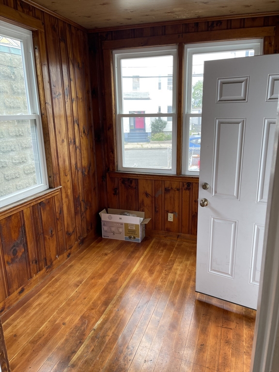 79 Newton Street, Unit 79 Somerville, MA 02143 - Photo 23 of 24 a view of a room with wooden floor and cabinet