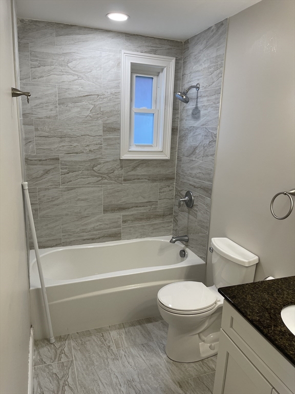 79 Newton Street, Unit 79 Somerville, MA 02143 - Photo 3 of 24 a bathroom with a toilet and a shower