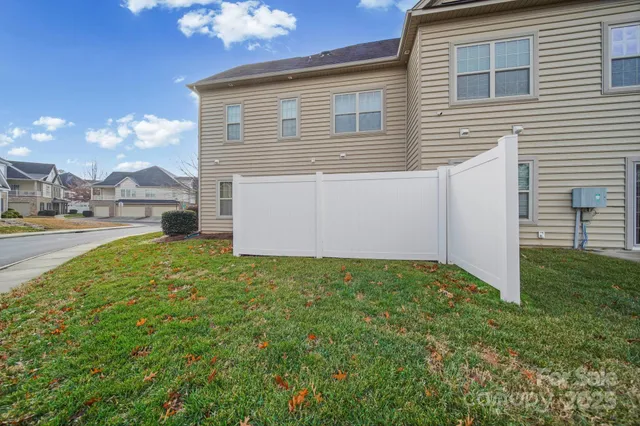 a view of a backyard of the house