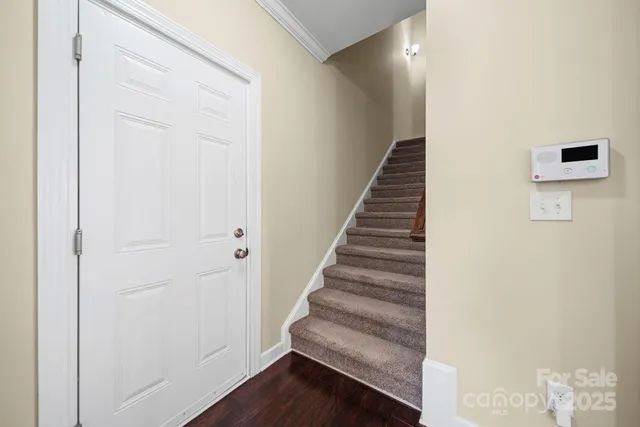 a view of entryway with wooden floor