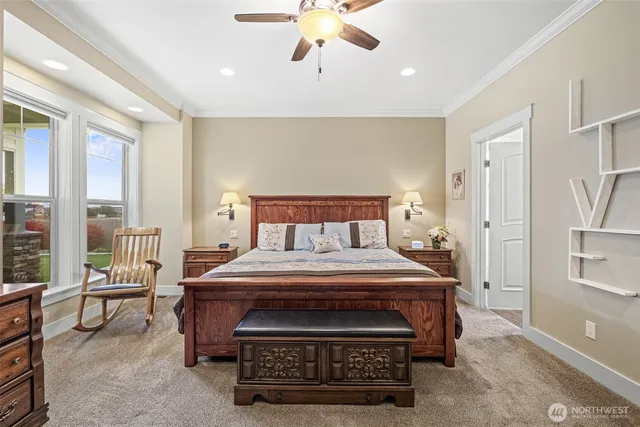 a bedroom with a bed a table and chairs