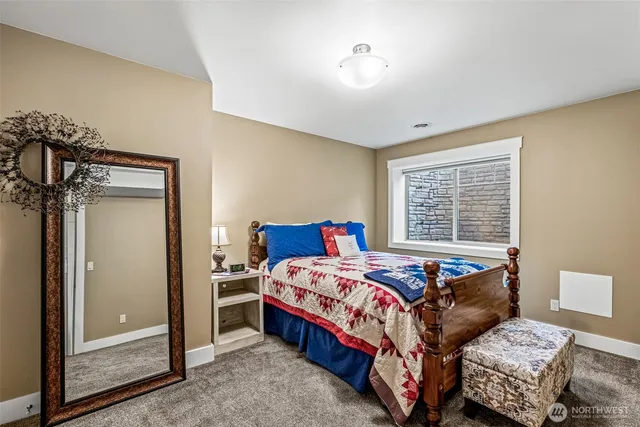 a bedroom with a bed and a dresser