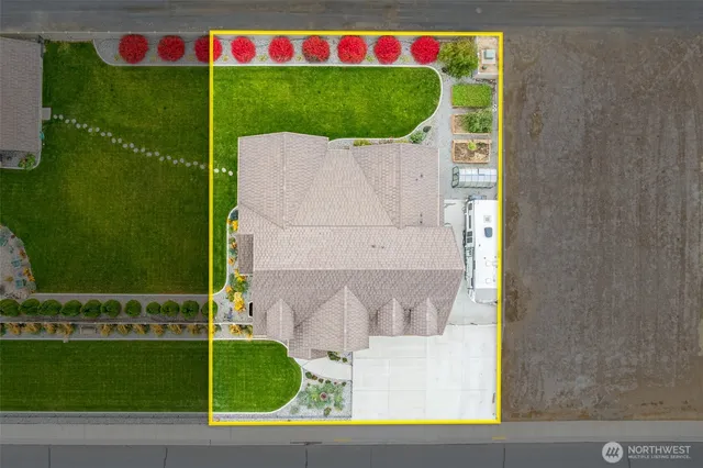 a view of swimming pool with a garden and plants