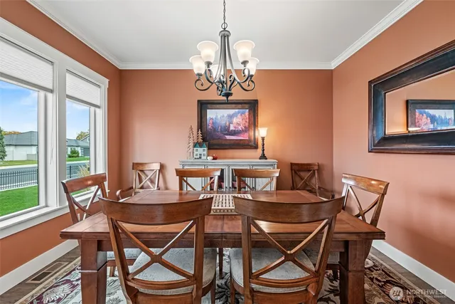 a view of a dining room with furniture window and outside view