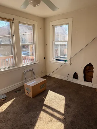 a living room with furniture and window